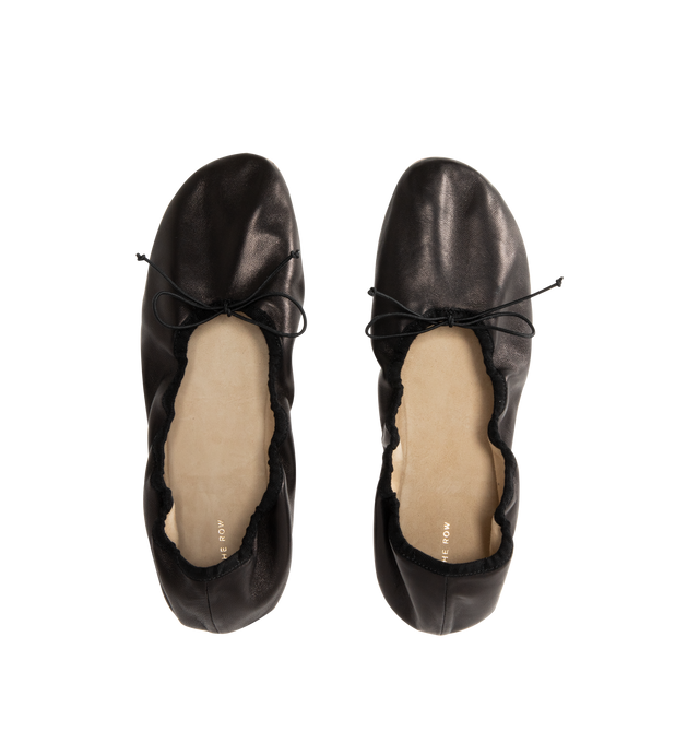 Image 4 of 4 - BLACK - The Row Classic ballet flat in smooth nappa leather with grosgrain piping, adjustable elastic tie, and flexible leather sole. 100% Lambskin Leather with leather sole. Made in Italy. 