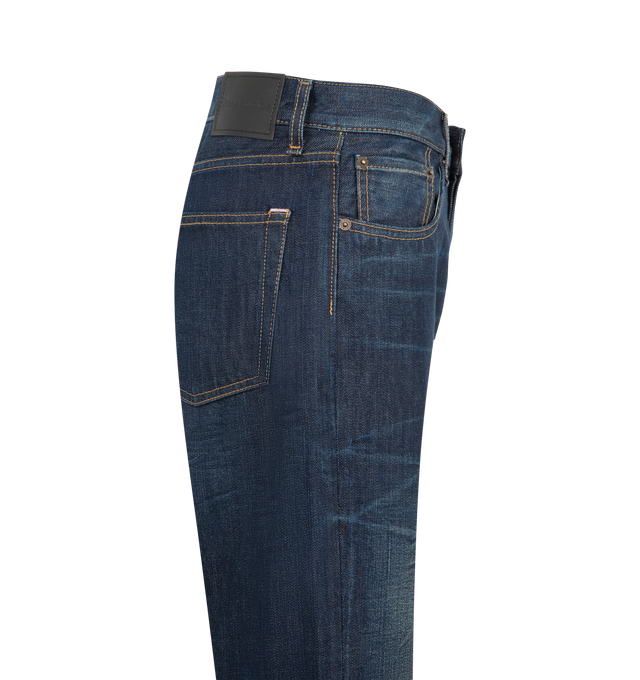 Image 3 of 3 - BLUE - Acne Studios Women's 2009F Deep Dive Jeans are crafted from dark natural indigo-blue non-stretch denim and feature subtle whiskering, light scraping, and stained detailing for an authentic worn-in effect. Designed in the brands 2009 fit, the jeans are cut to a regular fit with a mid-to-low rise, slim leg, and long length. A classic five-pocket construction and button fly complete the design. Made from organically grown cotton. Main Material: 100% Cotton. Patch: 100% Cow Leather.  