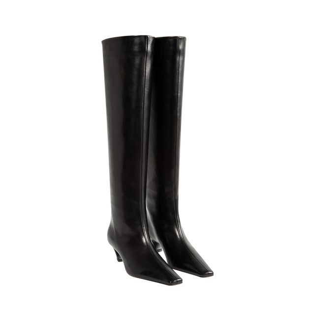 Image 2 of 4 - BLACK - Khaite Women's Knee-High Boot is crafted from smooth calfskin and features a streamlined silhouette with a modern square toe. Designed without closures for effortless pull-on wear, this Italian-made style balances clean lines with timeless versatility and is finished with a stacked heel for everyday comfort. Main Material: Calf Leather. Upper: Smooth Calfskin. Closure: Pull-On. Toe: Square. Heel Height: 5 cm / 2 in. Includes Dust Bag. Made in Italy. 