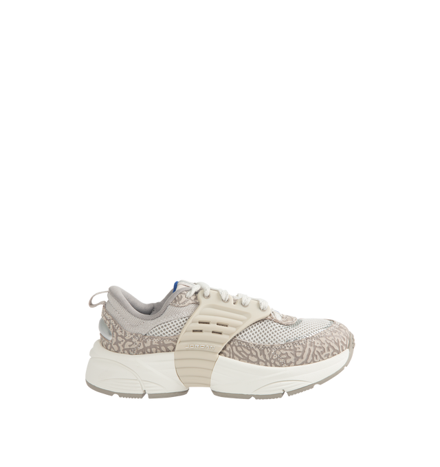 Image 1 of 5 - GREY - Women's Jordan Trunner O/S Sneakers feature a breathable mesh upper with suede overlays and a modern silhouette inspired by the original Jordan Trunner. These lifestyle sneakers combine responsive foam cushioning, molded midfoot support wings, and a durable rubber outsole for lightweight comfort, stability, and everyday traction. Main Material: Mesh and Suede. Midsole: Responsive Foam. Sole: Rubber. 
