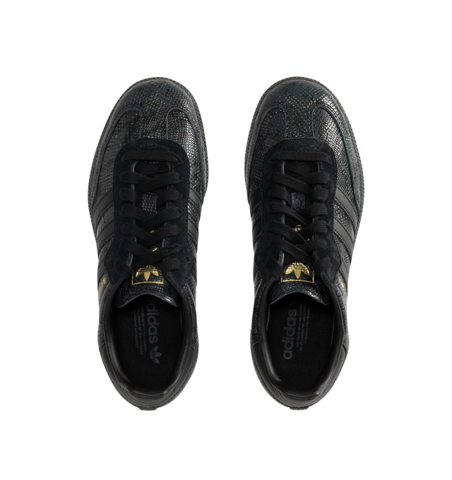 Image 5 of 5 - BLACK - Adidas Men's Samba OG Snake-Effect Sneakers are crafted from calf leather. Features a snake-effect finish, round toe, lace-up closure, signature 3-Stripes, logo-print tongue, branded heel counter, and flat rubber sole. Upper: Calf Leather; Lining: Calf Leather; Sole: Rubber. Made in Cambodia. 