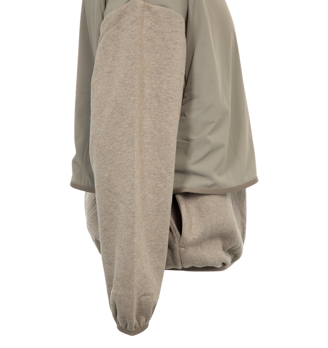 Image 3 of 4 - GREY - FEAR OF GOD ESSENTIALS Nylon Fleece Hooded Sweater featuring elastic cuffs and hem, side pockets, rubber logo on front and nylon shell and hood. 80% cotton, 20% polyester. 