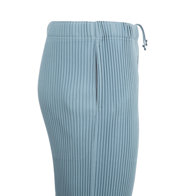 Image 6 of 6 - BLUE - ISSEY MIYAKE August Pant featuring a short length, pockets on both sides, draw cord at the waist and a button-fly design. 100% polyester. Made in the Philippines. 
