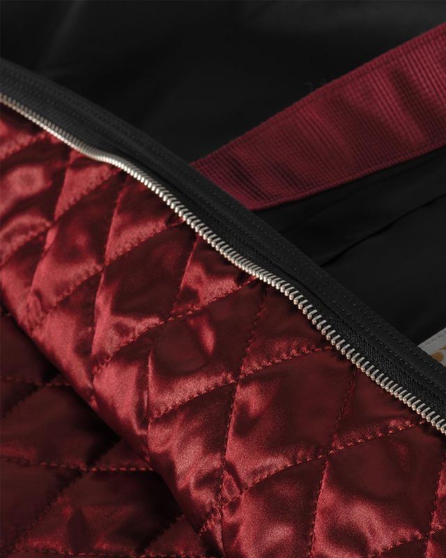 Image 4 of 4 - BLACK - CARHARTT WIP Alumni Tote Bag featuring quilted contrasting lining, top zip fastening, double handles and external pocket. 17.7 x 25.5 x 7 inch. 100% nylon. 