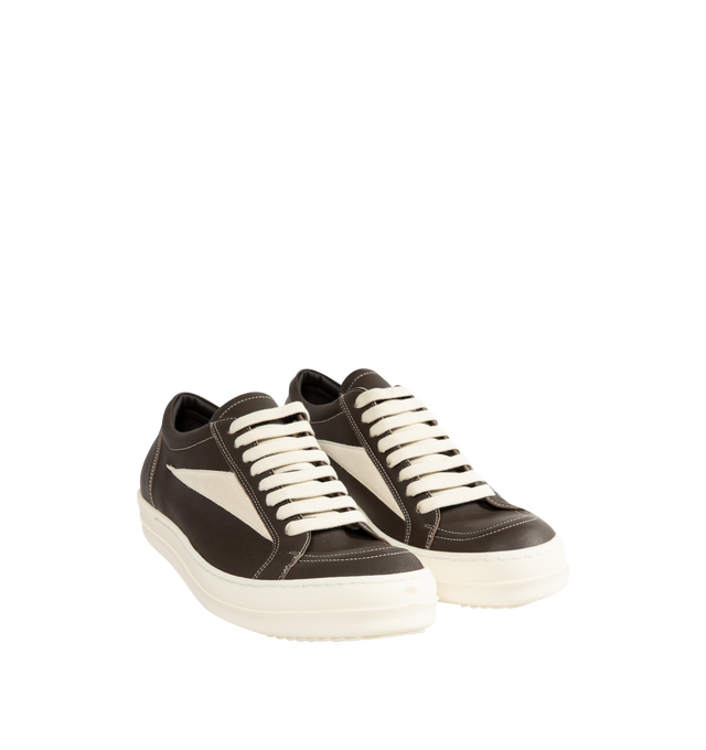 Image 2 of 5 - NEUTRAL - Rick Owens Men's Vintage Sneaks are crafted from full-grain cow leather and suede leather and feature an under-ankle silhouette with eight-eyelet lace-up fastening, toe caps, and signature shark-toothed bumper soles. Designed with a triangular leather appliqu at the side, a padded ankle, and contrast stitching that references the brand's iconic vintage-inspired sneaker aesthetic. Main Material: 100% Cow Leather. Lateral Details: 100% Calf Leather. Lining: 100% Calf Leather. Insole:  