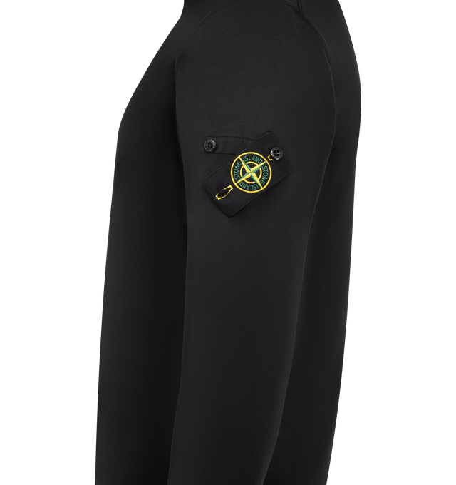 Image 3 of 3 - BLACK - STONE ISLAND Crewneck Sweatshirt featuring ribbed neckline, lunette under back neckline with internal reinforcement, raglan sleeves on back, Stone Island badge on left sleeve, ribbed cuffs and bottom band, overlock stitching at seams and regular fit. 100% cotton. 