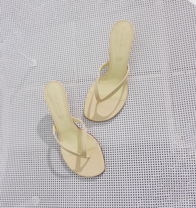 Image 2 of 5 - NEUTRAL - AMINA MUADDI Juliette Thong Sandal featuring rounded open toe, thong strap and 45mm mini CL heel. 100% lambskin. Made in Italy.  