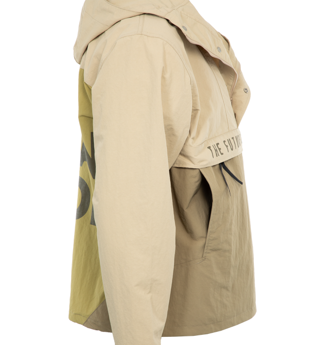 Image 3 of 5 - NEUTRAL - HUMAN MADE Anorak Parka featuring hooded with branded adjustors, half zipper with snap buttons, concealed front pockets, adjustable cuffs with velcro, heart panel in an alternate color on the back and adjustable hem. 100% nylon. 