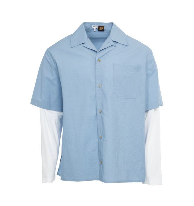 Image 1 of 3 - BLUE - Loewe Paula's Ibiza Trompe L'Oeil Shirt crafted in lightweight textured cotton poplin and cotton jersey in a relaxed fit and regular length with Trompe loeil construction, camp collar, contrasted long sleeves, button front fastening and chest patch pocket with Anagram embroidery placed on the chest.Loewe Paula's Ibiza 2024 collection is inspired by the iconic Paula's boutique, synonymous with the counter cultural movement of 1970s Ibiza, captures the liberated vibe of summer with high  