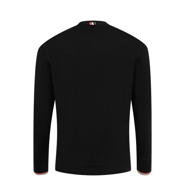 Image 2 of 3 - BLACK - Thom Browne Men's RWB Tipping Stripe Wool Jersey Henley Shirt is crafted from stretch wool jersey and features the brands signature red, white, and blue tipping stripes at the rib-knit cuffs. Designed with a classic Henley silhouette, the shirt is finished with a crewneck, long sleeves, and a button-front placket for a refined everyday look. Main Material: 96% Wool, 4% Elastane. Made in Italy. 