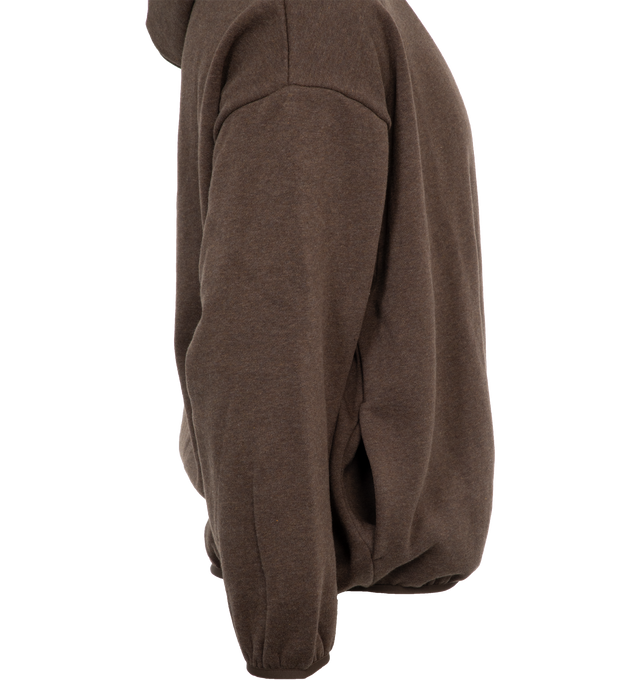 Image 3 of 4 - BROWN - FEAR OF GOD ESSENTIALS Hoodie featuring elastic waist and cuffs, fixed hood, side pockets and rubber logo on chest. 100% cotton.  
