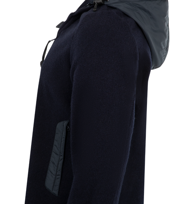 Image 3 of 3 - NAVY - ASPESI Giubbotto Werner Jacket featuring Shetland wool outer, nylon-lined front body and sleeves, stand-up collar, nylon welt pockets, knitted cuffs, zip trim, hood with adjustable drawstring, branded cord locks, drawstring at the hem, double-slider front zip fastening and slim fit. 100% wool. 