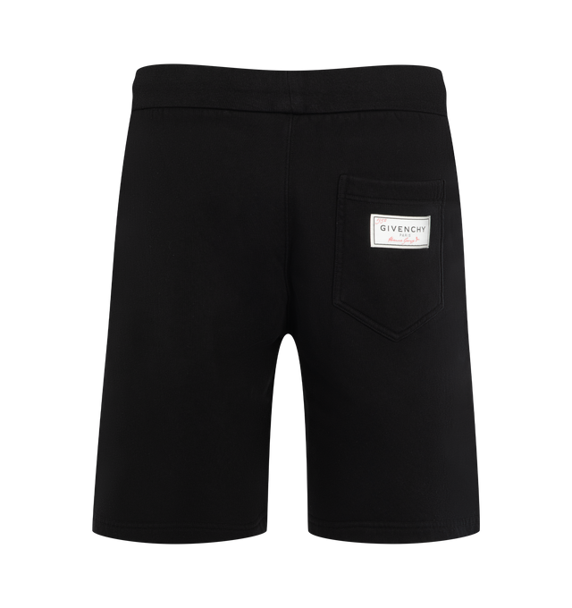 Image 2 of 3 - BLACK - Givenchy Men's Couture Seam Shorts are crafted from soft fleece and feature an elasticated drawstring waistband and signature couture seam construction that creates a rounded silhouette. Designed for elevated everyday comfort, this relaxed Bermuda style is finished with contrasting Givenchy Paris embroidery at the front left leg, a Givenchy Paris Archives label at the back, and multiple pockets for functionality. Main Material: Cotton Fleece. 