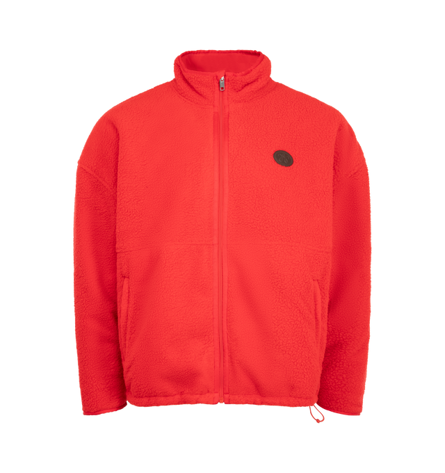 Image 1 of 3 - RED - The Willy Reversible Fleece is cut in an oversized silhouette with a stand collar and adjustable hem for a relaxed, customizable fit. Designed to be worn two ways, the reversible construction features a plush fleece exterior and smooth nylon interior, with branded zip pockets on both sides. 