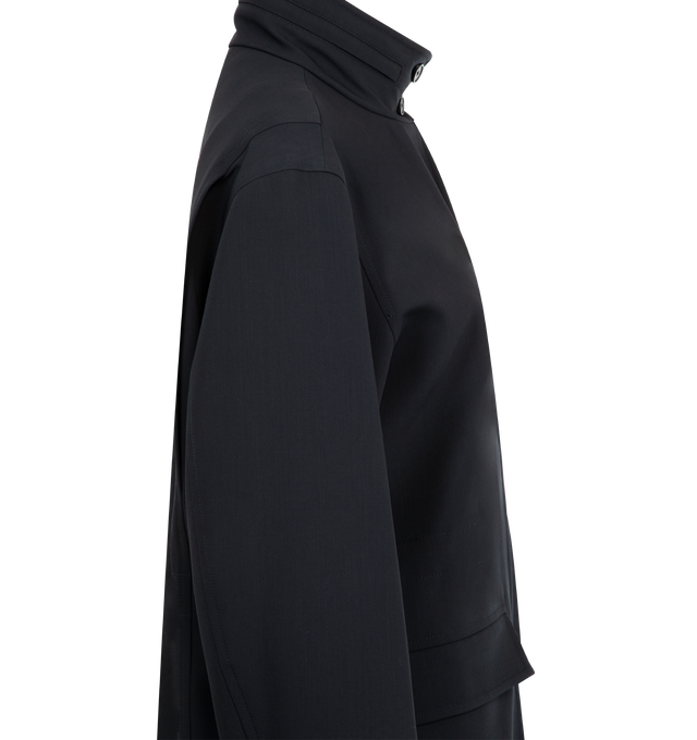 Image 4 of 5 - NAVY - THE ROW Tanera Jacket in smooth virgin wool gabardine with concealable hood at collar, adjustable interior drawstring waistband and concealed front placket with zipper and button closures. 100% wool. Lined in 100% silk. Made in Italy. 