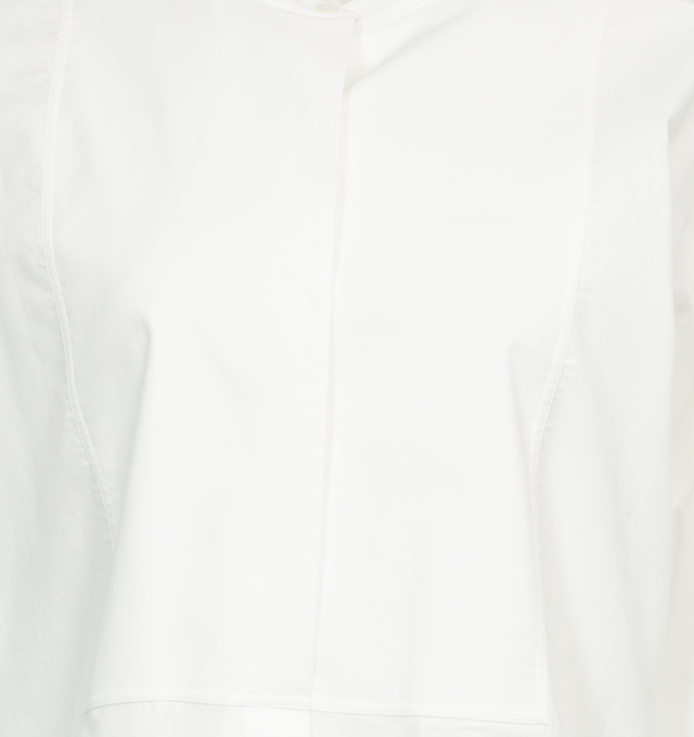 Image 3 of 3 - WHITE - THE ROW Hari Cotton Longline Shirt featuring band collar, long sleeves, button cuffs and button-front placket. 100% cotton. Made in Italy. 