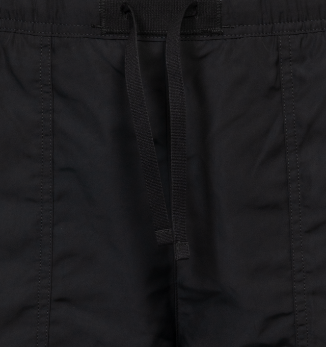 Image 4 of 4 - BLACK - STONE ISLAND Swim Trunks featuring regular fit, patch hand pockets with slanting opening edged with inner tape, back patch pocket with fixed flap and hidden zipper closure with nylon trim, Stone Island Compass patch logo on the left leg, inner mesh lining and elasticized waistband with outer drawstring set on tap tab. 100% polyester. Lining: 100% polyamide/nylon. 