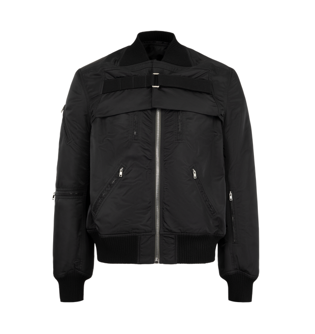 Image 1 of 4 - BLACK - Rick Owens Men's 2 Piece Flight Jacket is crafted from washed bomber satin and features a modular two-piece construction with a sleeveless zip-front body and detachable sleeve overlay. Designed with two vertical zip pockets, two diagonal front zip pockets, zipped forearm pockets, a diagonal upper-arm pocket, and a front strap with metal buckle detail, this runway style combines utilitarian functionality with the brand's signature experimental approach. Finished with rib-knit trims and 