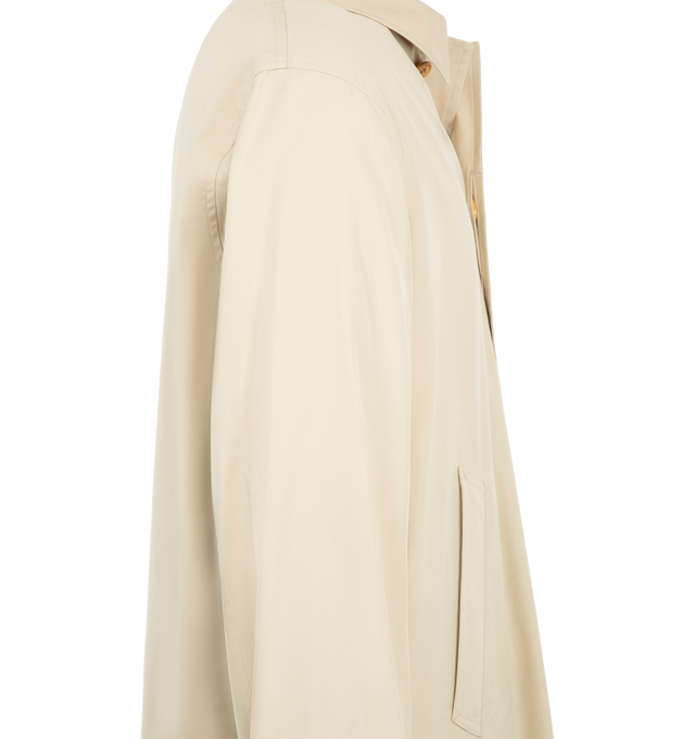 Image 3 of 3 - CREAM - Visvim Bochco Soutien Coat is crafted from custom-treated cotton nylon pinpoint oxford cloth and features a classic soutien coat silhouette with a concealed front closure, custom water buffalo buttons, and a custom zip fastener. Designed for versatility across seasons, this elevated outerwear style is finished with a detachable custom-treated wool fleece lining and a one-wash treatment for a softened, lived-in feel. Main Material: 81% Cotton, 19% Nylon. Made in Japan. 