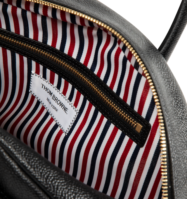 Image 3 of 3 - BLACK - THOM BROWNE Pebble Grain Goose Bag featuring rounded leather handles, brass zip top closure, exterior vent pockets, interior zip pocket, tricolor stripe lining and signature striped grosgrain loop tab. 100% calf full grain leather. Lining: 100% polyester. Made in Italy. 