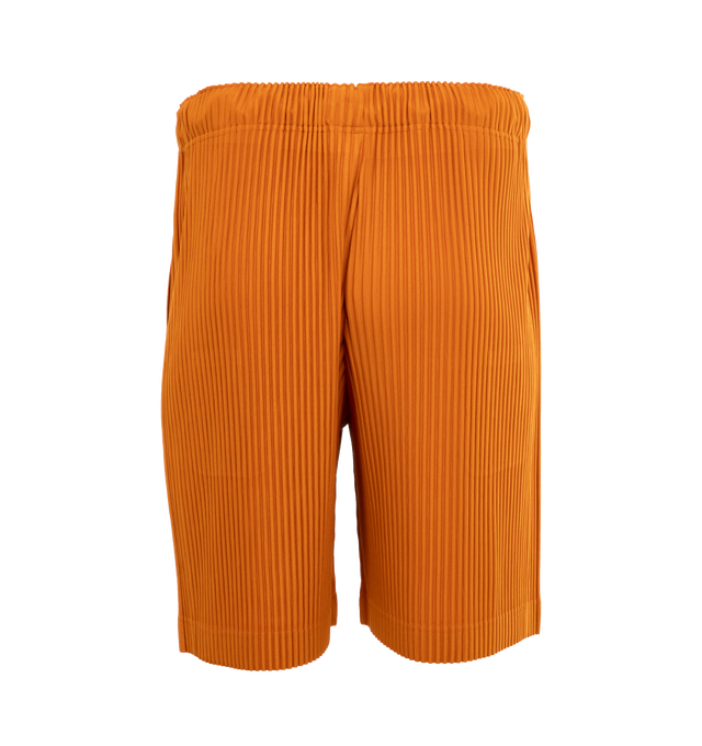 Image 2 of 4 - ORANGE - ISSEY MIYAKE Pants featuring a relaxed, wide leg, two side pockets, and an elastic drawstring waist. 100% polyester. 