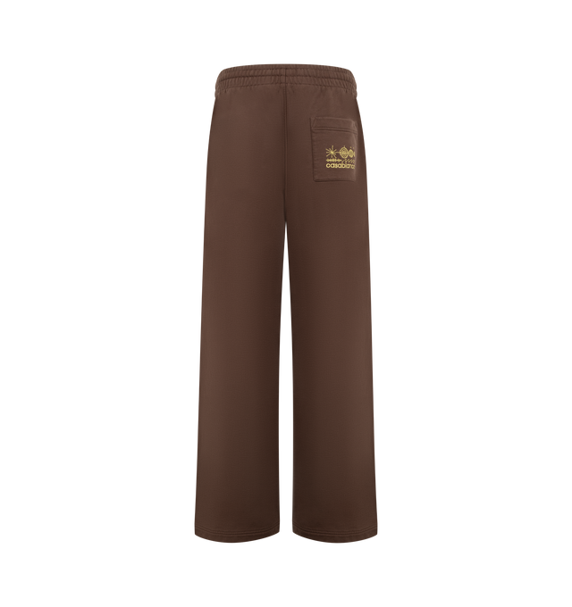 Image 2 of 3 - BROWN - Casablanca Men's Embroidered Pintuck Joggers are crafted from premium cotton and feature a relaxed silhouette with pintuck detailing, an elasticated drawstring waistband, ribbed cuffs, side pockets, and signature embroidered branding. These designer joggers combine exceptional everyday comfort with Casablanca's refined luxury sportswear aesthetic, creating an elevated essential for casual styling. Main Material: 100% Cotton. 