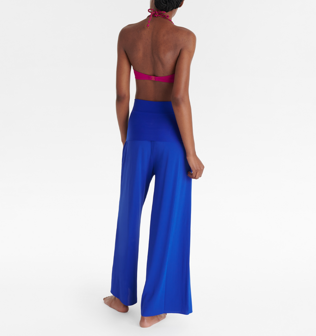 Image 4 of 6 - BLUE - ERES Dao High-Waisted Trousers featuring wide legs and side pockets with tone on tone stitching. Offers versatile styling to wear as a bustier jumpsuit or pants.  Main: 94% Polyamid, 6% Spandex. Second: 84% Polyamid, 16% Spandex. Made in France. 