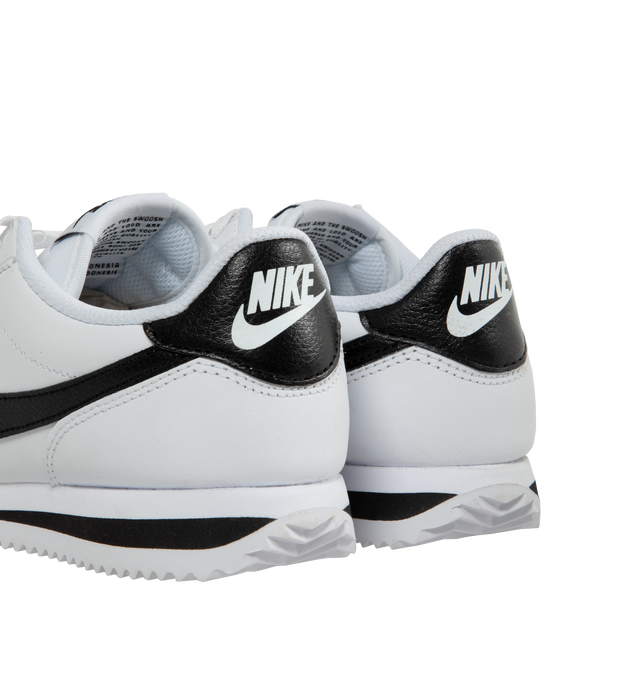 Image 3 of 5 - WHITE - NIKE CORTEZ leather lace-up sneaker featuring foam midsole, wedge insert, leather upper, rubber sole with herringbone pattern and a padded, low-cut collar. 