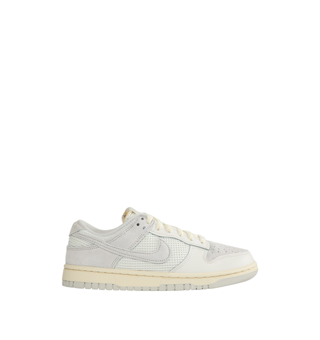 WHITE - NIKE Dunk low-top sneakers in a lace-up style crafted with leather upper, textile lining and rubber sole.