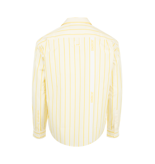 Image 2 of 3 - YELLOW - Jacquemus La Chemise Simon has a point collar, a button front closure, dropped shoulders, pleats in the back, and a classic fit. 100% cotton. Made in Portugal.  