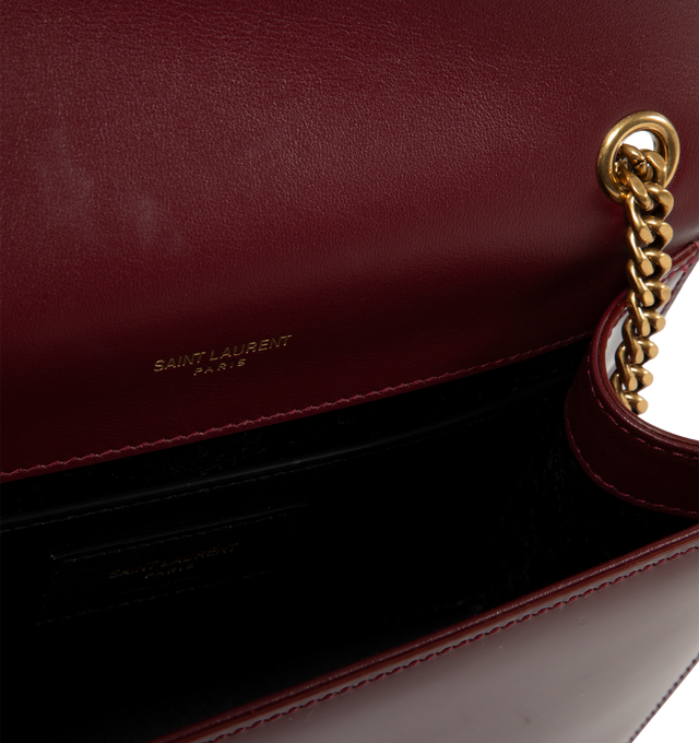 Image 3 of 3 - RED - SAINT LAURENT Kate Small Bag in Patent Leather featuring curb chain, grosgrain lining, magnetic fastening and interior slit pocket. 4.9"H x 7.8"W x 2"D. Strap drop: 56cm. 90% calfskin leather, 10% metal. Made in Italy. 