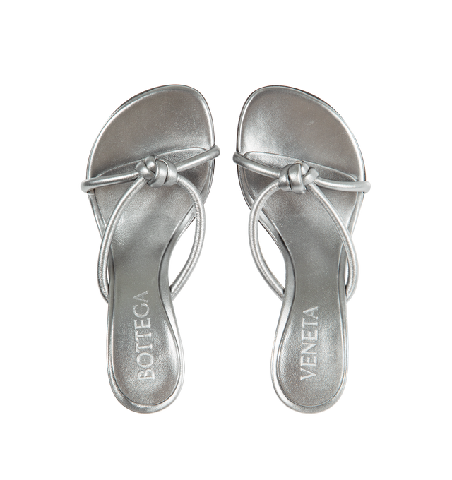 Image 4 of 4 - SILVER - BOTTEGA VENETA Blink Metallic Sandal featuring tubular straps of lambskin leather interlaced to the label's signature knot, asymmetric toe, pebbled rubber sole, cushioned footbed, leather upper and rubber sole. 95mm. Made in Italy. 