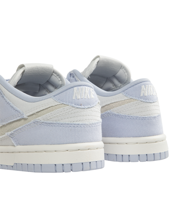 Image 3 of 5 - WHITE - Nike Dunk Low Sneakers are a lace-up style with foam midsoles, cutout Swoosh logos, padded collars, and rubber outsoles.  