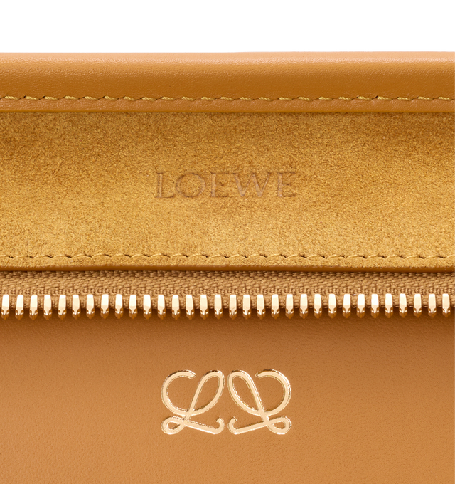 Image 15 of 16 - YELLOW - Loewe Women's Amazona 180 Medium Bag is crafted from suede and calf leather and features a relaxed silhouette with a single toron top handle, a concealed magnetic closure, and removable shoulder and crossbody straps. Designed with two compartments, an internal flat pocket, and a side D-ring for personalization, this versatile style can be carried by hand, over the shoulder, or crossbody. Suede lining and embossed LOEWE branding complete the design. Main Material: Suede/Calf Leather 