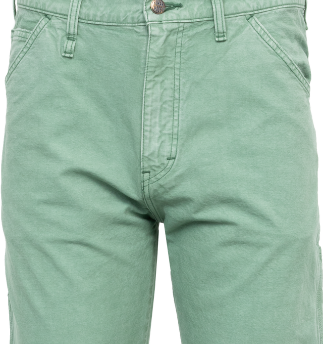 Image 4 of 4 - GREEN - HUMAN MADE Garment Dyed Painter Pants featuring straight cut, side pockets, garment dyed, carabiner hook, duck pocket patch and button fly. 100% cotton. 