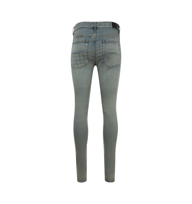 Image 2 of 3 - BLUE - AMIRI MA Quad Contrast Skinny Jeans featuring fading and whiskering throughout, belt loops, five-pocket styling, button-fly, leather logo patch at back waistband and skinny fit. 100% cotton. Made in United States. 