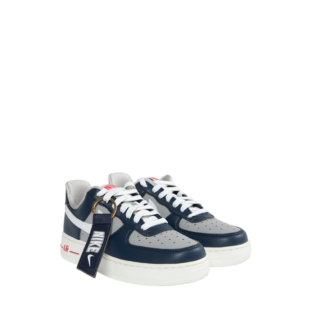 NAVY - NIKE WMNS AIR FORCE 1 '07 SE features Air cushioning that delivers lasting comfort and low-cut, padded collar, rubber outsole adds durability and traction, foam midsole and perforations on the toe.