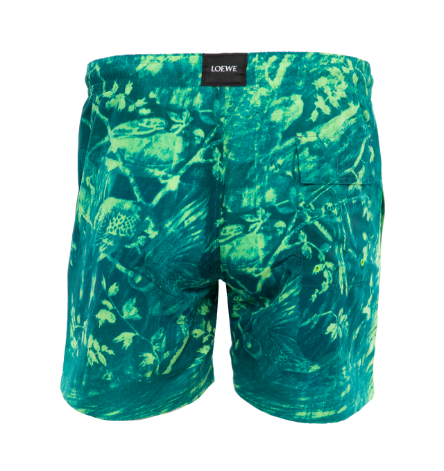 Image 2 of 4 - GREEN - Loewe Paula's Ibiza Swim Shorts crafted in lightweight technical shell in a regular fit, short length with placed parrot print, elasticated waist with drawstring, seam pockets, rear flap pocket with eyelets, mesh lining and LOEWE patch placed at the back. Main material: Polyester. Made in: Italy.Loewe Paula's Ibiza 2024 collection is inspired by the iconic Paula's boutique, synonymous with the counter cultural movement of 1970s Ibiza, captures the liberated vibe of summer with high im 