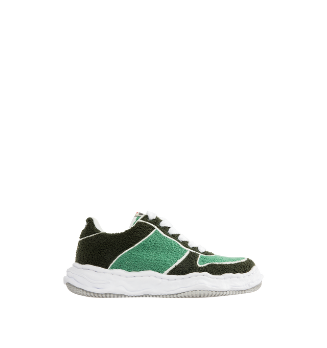 Image 1 of 5 - GREEN - Maison Mihara Yasuhiro Men's Wayne Sneakers feature the brand's signature hand-sculpted OG sole, a canvas upper adorned with soft chenille embroidery, and a low-top silhouette for a bold contemporary look. Designed for the Spring/Summer 2026 collection, these designer sneakers combine Maison Mihara Yasuhiro's experimental aesthetic with rich texture and artisanal detailing, while the sculptural sole and intentional vintage-inspired finishing create a distinctive statement silhouette.  
