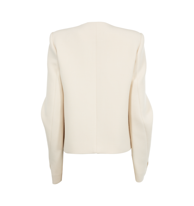 Image 2 of 3 - WHITE - Khaite classic jacket reimagined. Clean lines at the neckline and shoulders are softened by curved seaming and sculpted sleeves. Chrome snap buttons. Structured wool suiting (53% polyester, 43% wool, 4% elastane). 