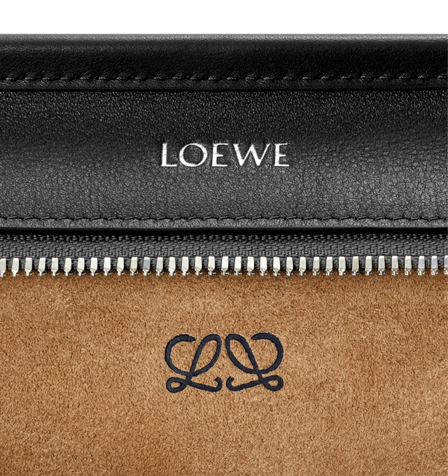 Image 15 of 17 - BLACK - Loewe Amazona Medium 180 Bag in soft calfskin leather featuring a relaxed silhouette with a single toron top handle, designed to be carried open, while a concealed closure secures the main compartment, removable shoulder and crossbody straps, zip closure with two leather zip pullers, two compartments, main compartment closed with magnetic closure, internal flat pocket, suede lining and embossed logo. Soft calfskin. Strap length 108 cm; Strap Drop 50 cm; Handle drop 11 - 28 cm; Heigh 