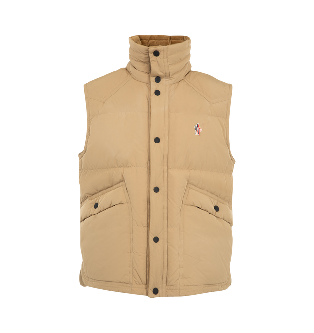 Image 1 of 1 - NEUTRAL - Moncler Grenoble Men's Evans Down Vest is crafted from micro soft polyester and features a down-filled construction, a convertible high collar that can be worn upright or folded into a pointed collar, and snap-button front closures. Designed for mountain and everyday wear, it is finished with elastic corduroy trim at the collar and inner placket, a soft microfiber lining, and snap-button closure pockets. Main Material: 100% Polyester. Lining: 100% Polyester. Padding: 90% Goose Down, 