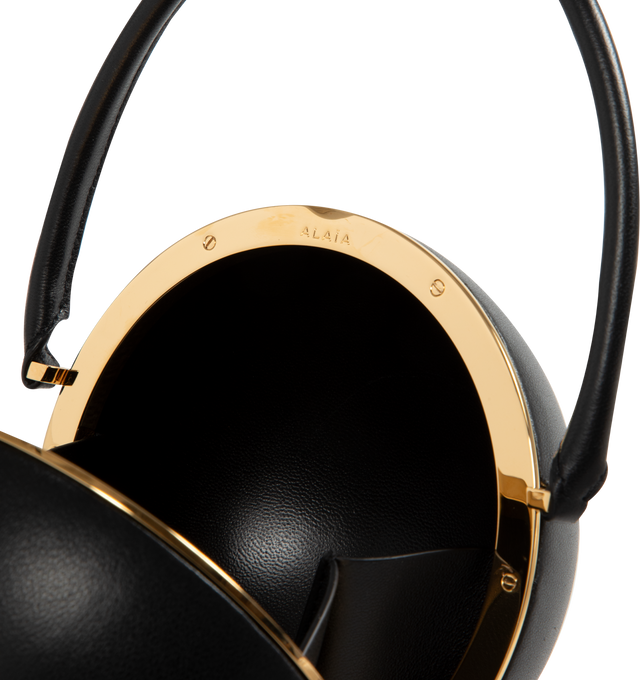 Image 3 of 3 - BLACK - Alaia Sphere Minaudie Handbag has a magnetic closure, hand carry handle, and gold toned hardware. Made in Italy 