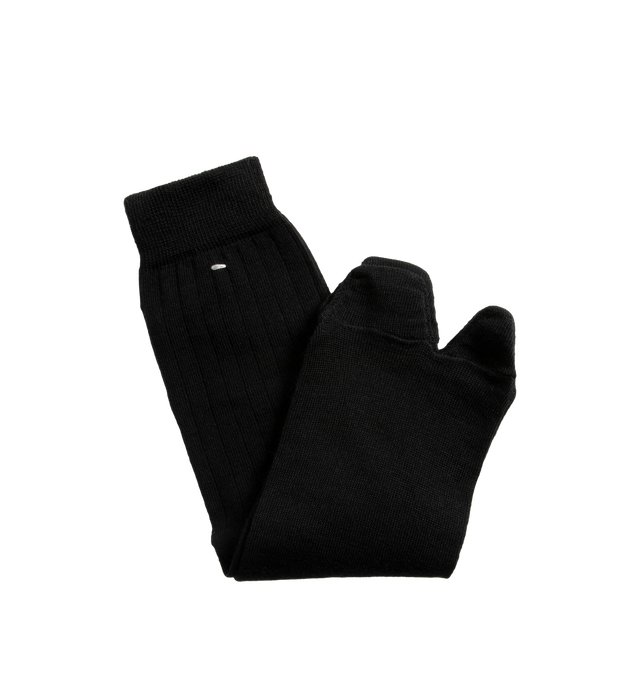 Image 2 of 2 - BLACK - Maison Margiela Tabi Socks are crafted from a wool-blend jersey and feature the Maison's iconic split-toe construction inspired by traditional Japanese tabi socks. Designed with ribbed cuffs, a mid-calf length silhouette, and the signature single white stitch at the back, these socks combine comfort with a distinctive archival design. Main Material: 78% Wool, 22% Polyamide. Made in Italy. 