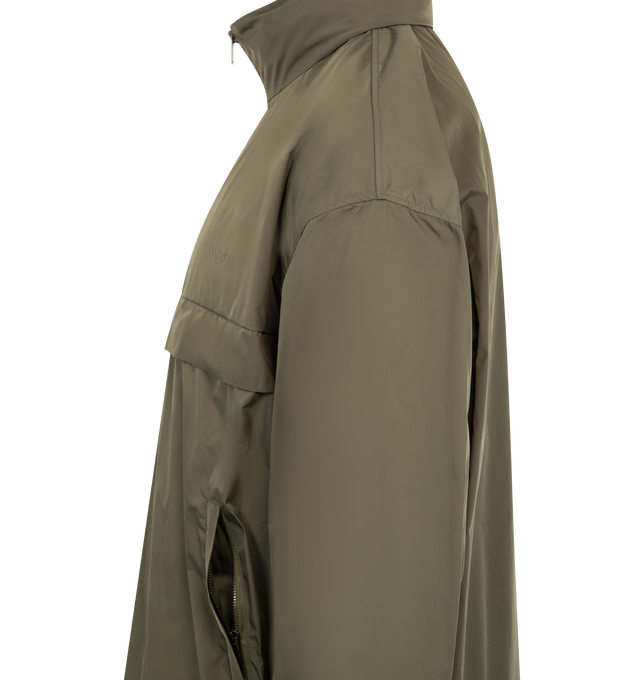 Image 4 of 4 - GREEN - SAINT LAURENT Windbreaker Jacket featuring stand collar with stowaway hood, water-repellent, zip-up closure, storm shield, drawstring hem, logo embroidery on the chest, two zip pockets at the front, elasticized cuffs, drop shoulders and drawstring hem. 100% polyester. Made in Italy. 