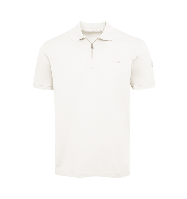 Image 1 of 2 - WHITE - MONCLER Zip Up Polo Shirt featuring short sleeves, tonal knit collar and cuffs, zipper closure, embossed logo lettering and synthetic material logo patch. 