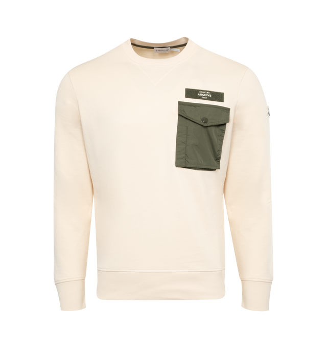 Image 1 of 2 - NEUTRAL - MONCLER Pocket Sweatshirt featuring lightweight cotton fleece blend, crew neck, chest pocket and embossed logo lettering. 87% cotton, 13% polyamide/nylon. Made in Turkey. 