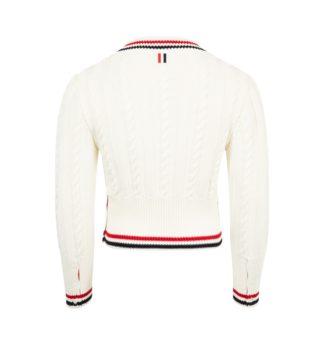 Image 2 of 2 - WHITE - THOM BROWNE Baby Cable V Neck Pullover featuring knitted construction, cable knit, striped border, plunging V-neck, side button fastening, long sleeves, buttoned cuffs, ribbed cuffs and hem and straight hem. Cotton.  