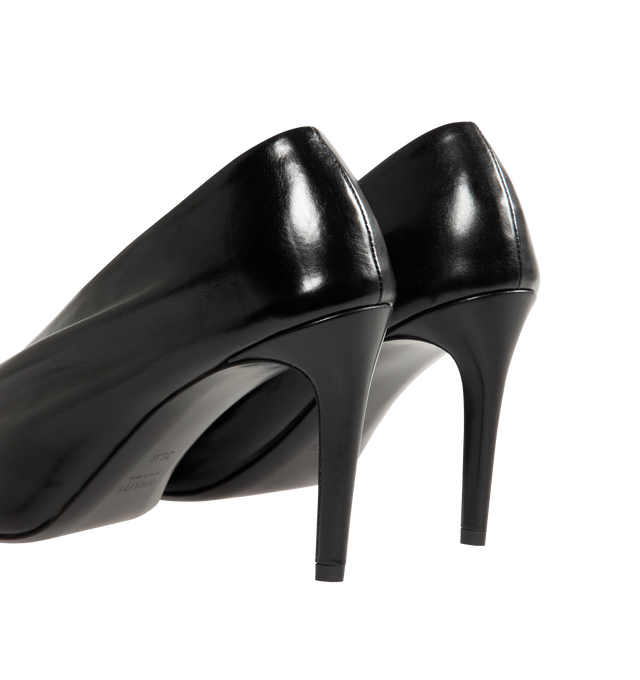 Image 3 of 4 - BLACK - Khaite pump inspired by the soft folds of fabric and crafted in Italy of glazed calfskin selected for its luminous shine. The deconstructed upper is lined in cigar-hued suede, accentuating a natural fit that moves with the foot. Detailed with signature gold staple. 2" high heel. Glazed calf (100% calfskin). Made in Italy. 