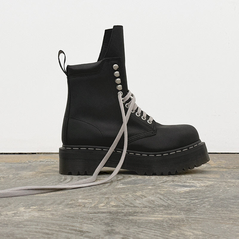 DR-MARTENS X RICK-OWENS COLLAB featuring a black platform combat boot style.